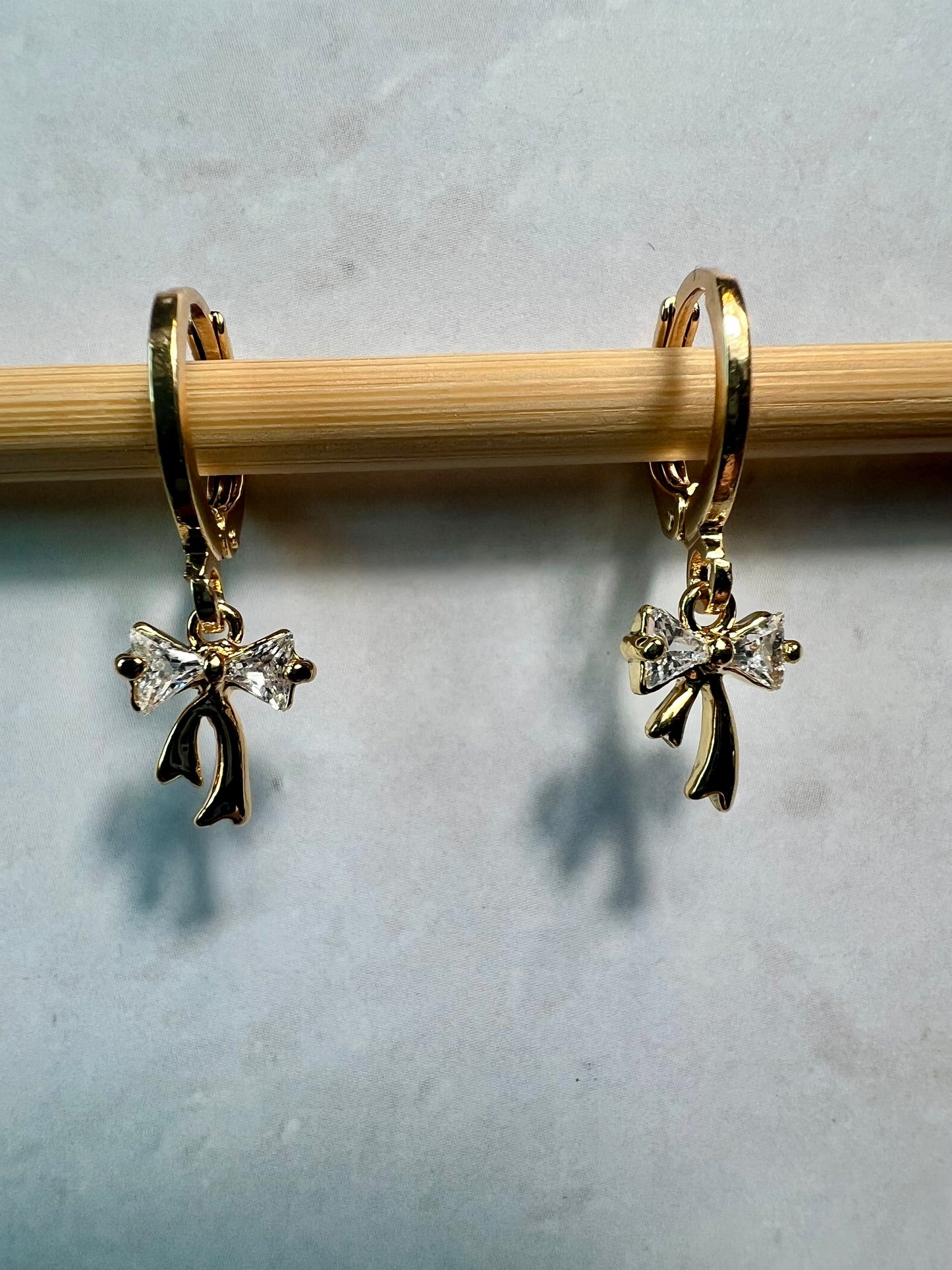 Gold Huggie Earrings with CZ Bow Charms, Dainty Coquette Jewelry, Ribbon Earrings